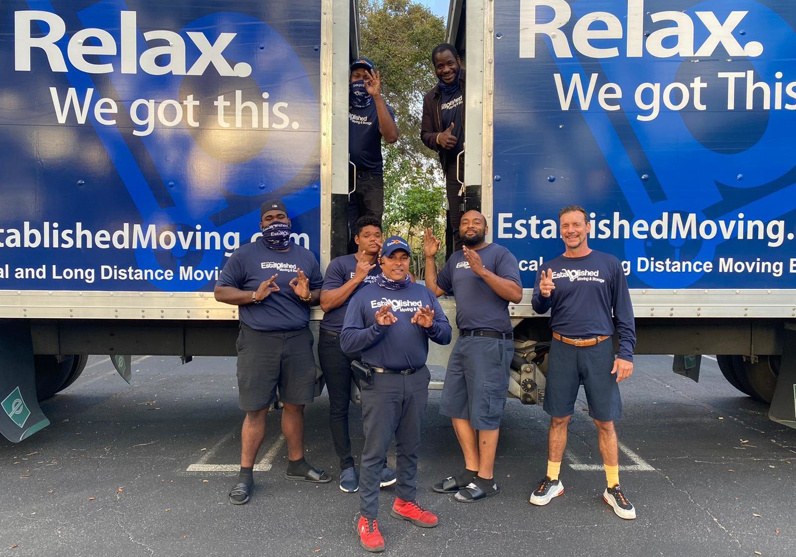 a group of established moving & storage employees celebrate a job well done