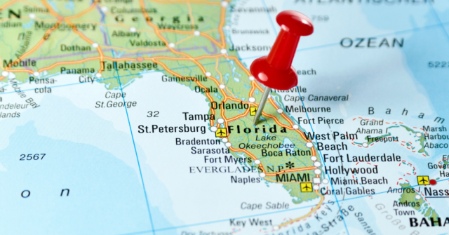 Photo showing a geographical map of Florida, with a push pin in the middle.